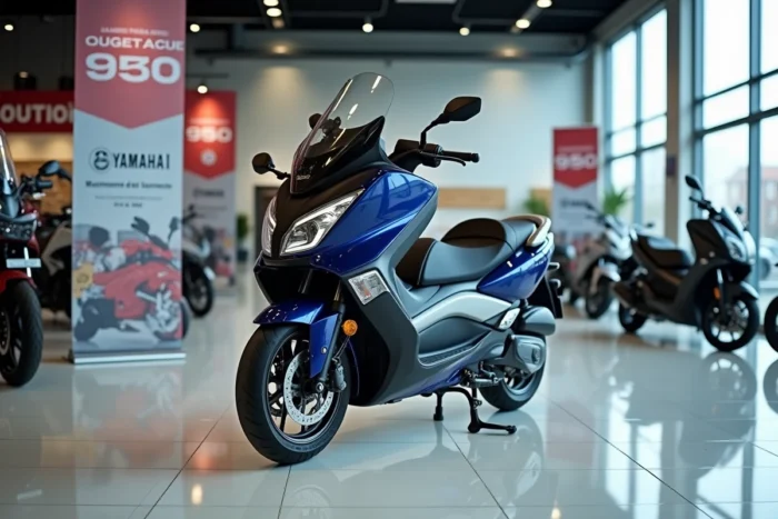 Yamaha TMAX 750 exposé dans une concession moto française avec des affichages de prix en arrière-plan, vue profil complète
